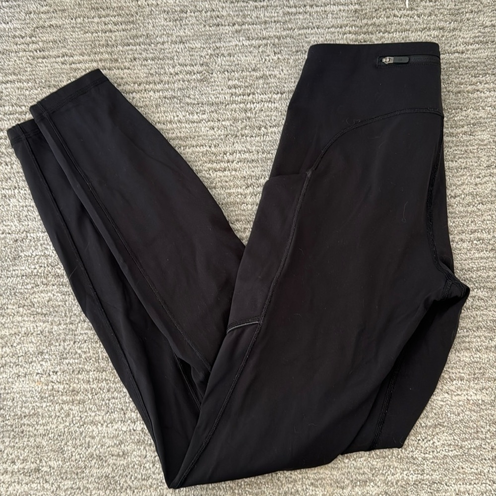 Lululemon ladies black leggings side pockets and back zip pocket size 4